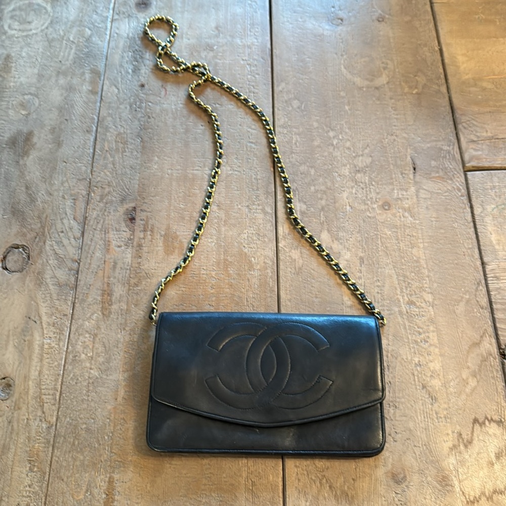 Chanel Caviar WOC vintage lambskin crossbody purse with gold chain.